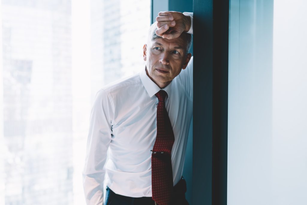 Senior worker stressed because of change demands.